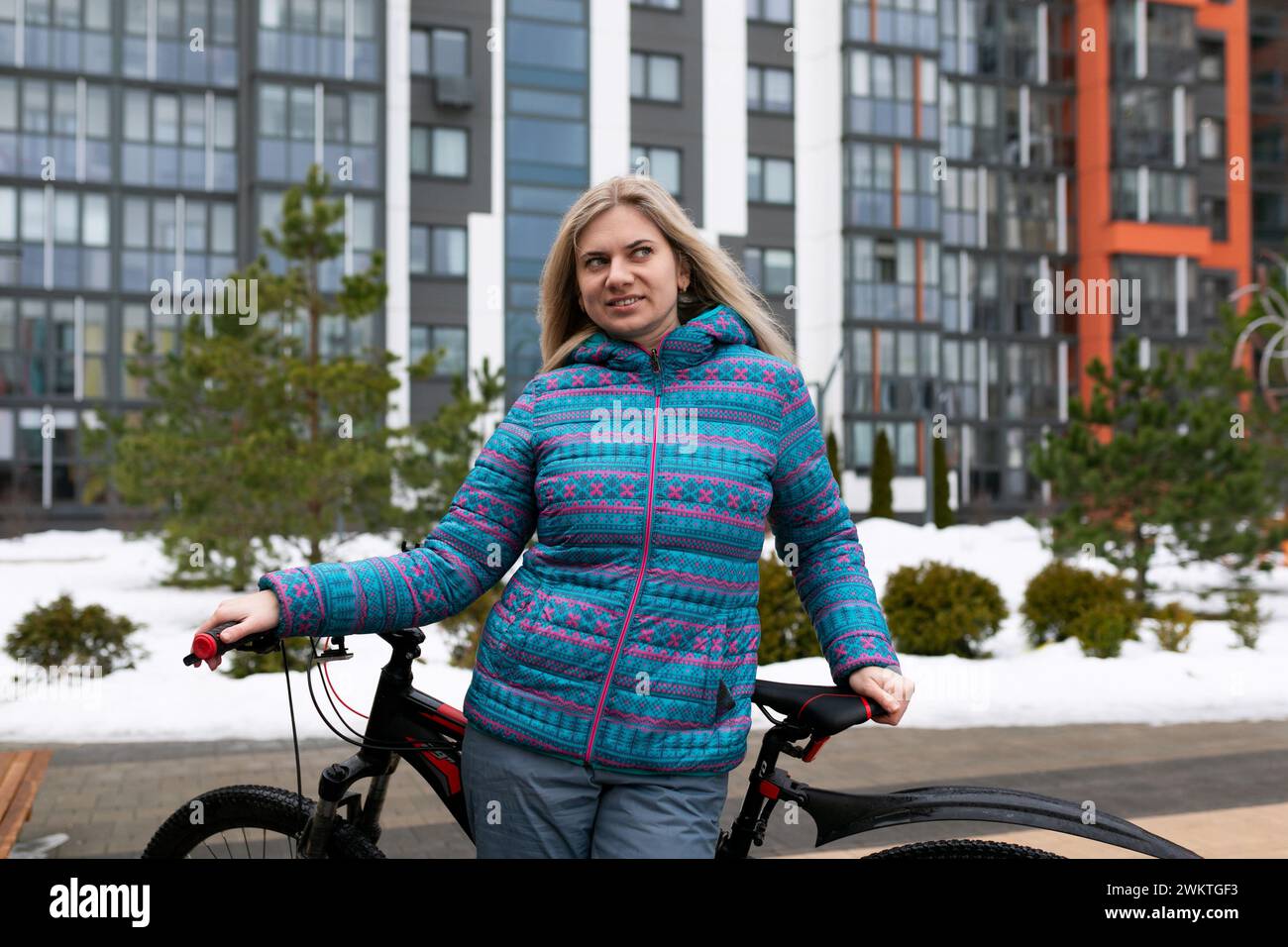 Nice young woman rented a bicycle Stock Photo