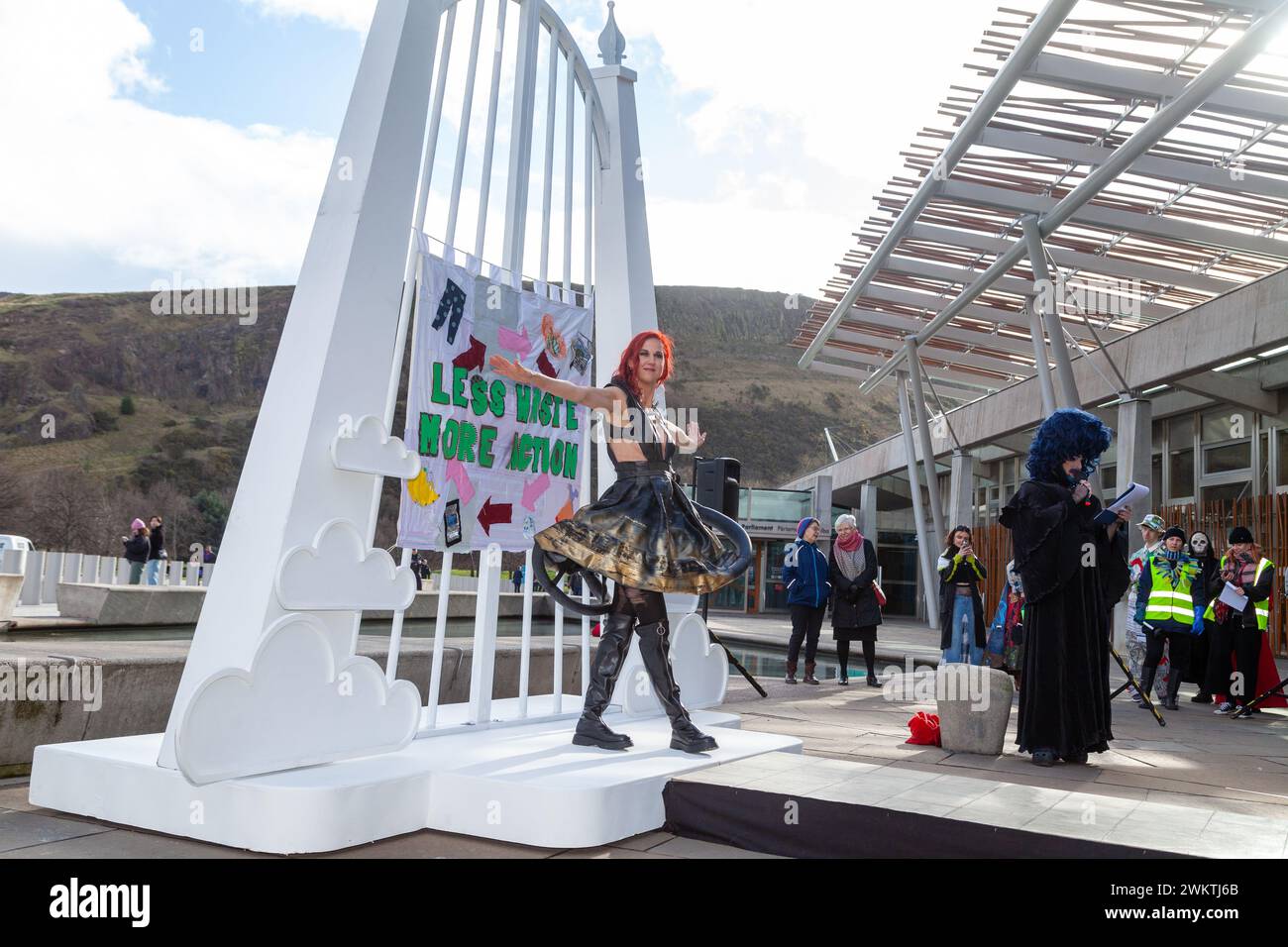 Edinburgh, Scotland. 22 February 2024.  A model in a dress made from recycled tyres struts on a catwalk outside the Scottish Parliament, to raise awareness of our wasteful and polluting levels of material consumption. © Richard Newton / Alamy Live News Stock Photo
