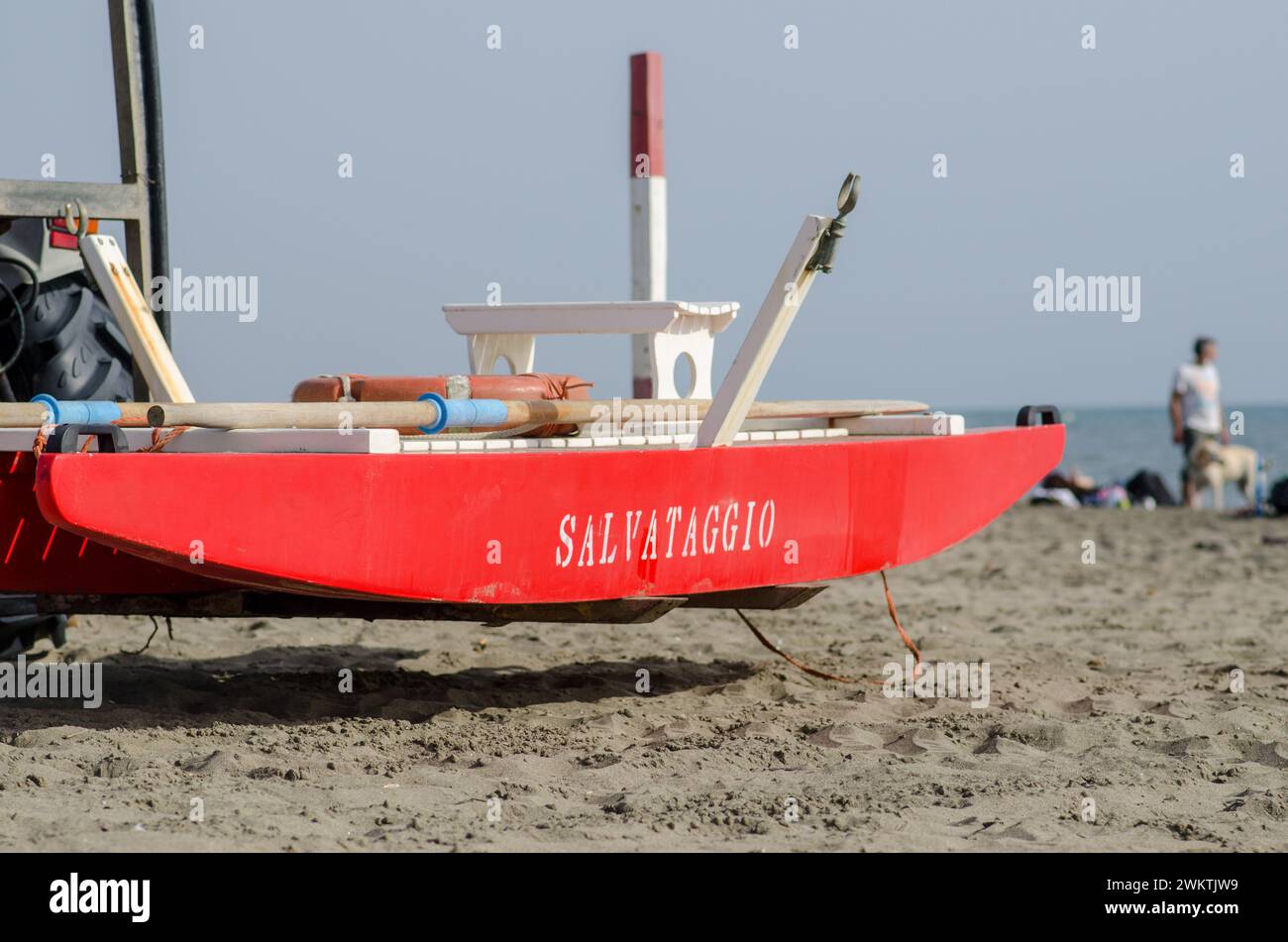 Lifeguard boat on the beach for emergencies, high visibility red color
