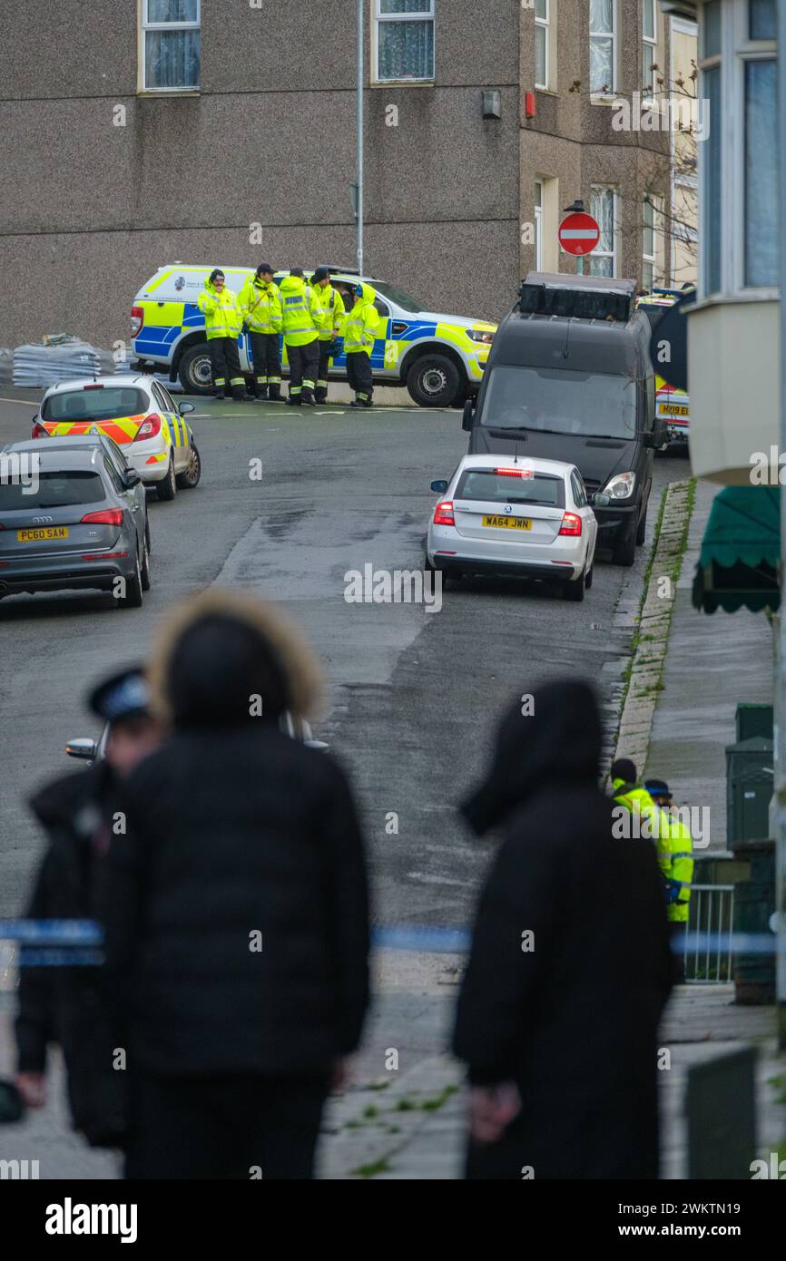 Members of HM Coastguard Search and Rescue gather after homes were ...