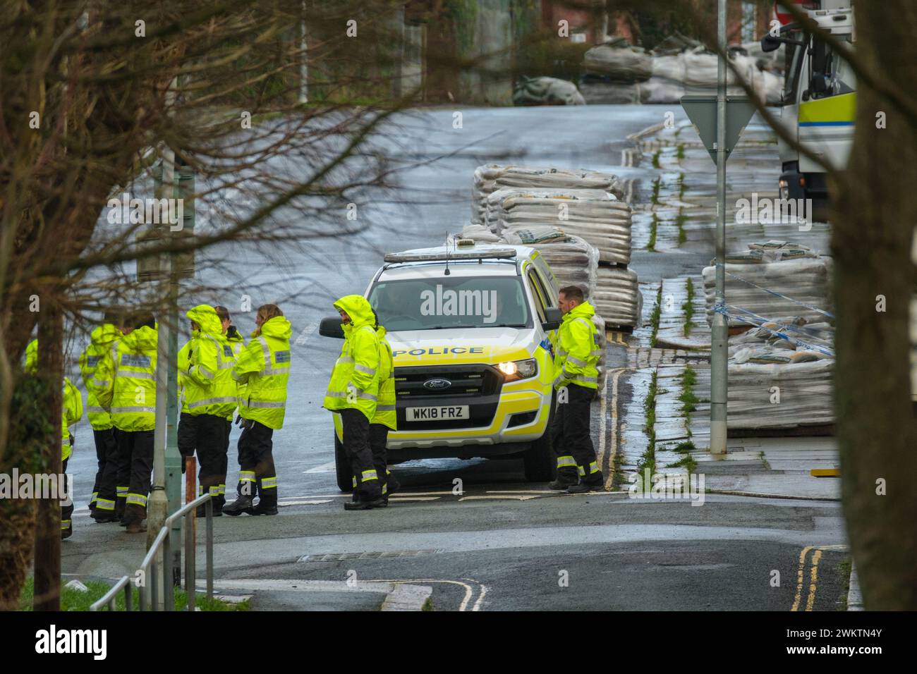 Members of HM Coastguard Search and Rescue gather after homes were ...