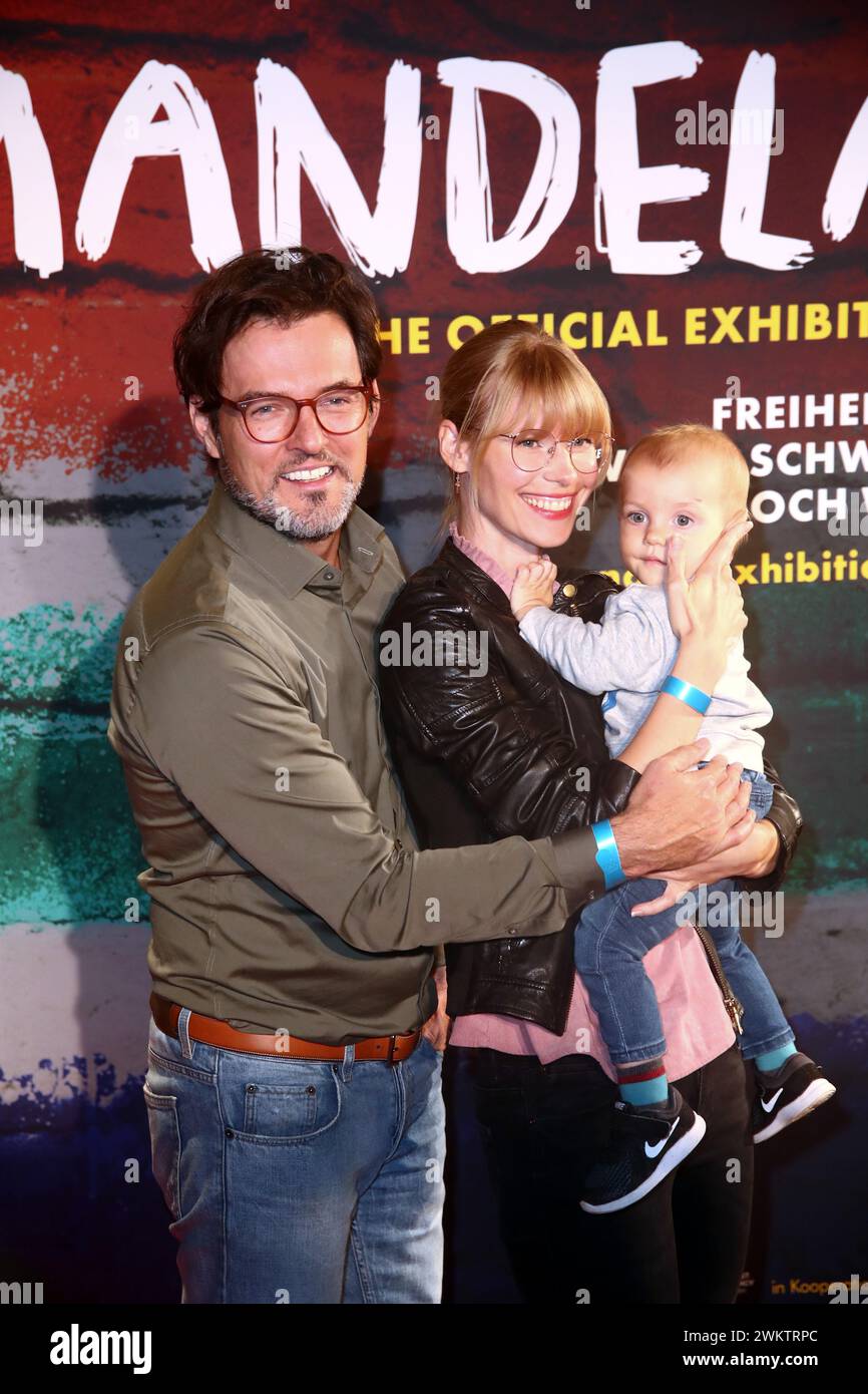 Tobey Wilson (also Tobias Rapp, real name Tobias Schmeißer) with Sabrina Gehrman and son Paul attends Opening of the exhibition Mandela: The Official Stock Photo