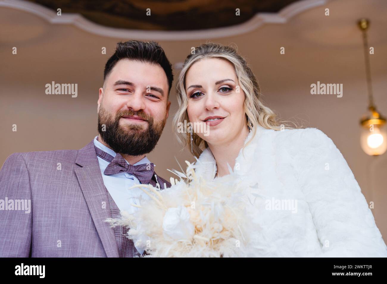 Bavaria, Germany - January 19, 2024: Happy newlyweds at the registry office. Bride and groom, husband and wife *** Glückliches Ehepaar frisch Verheiratet im Standesamt. Braut und Bräutigam, Ehemann und Ehefrau Stock Photo