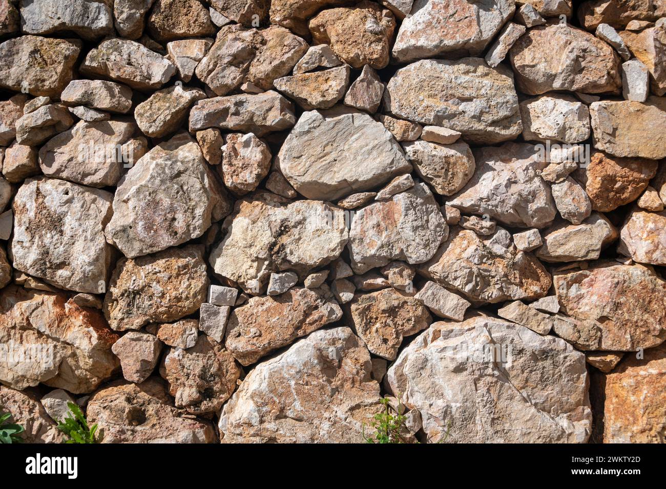 textured dry stone wall, close up section. Stock Photo