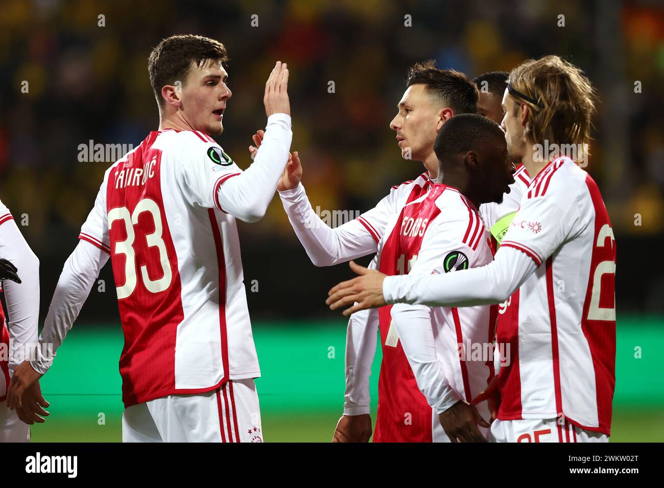 BODØ - (l-r) Benjamin Tahirovic of Ajax, Steven Berghuis of Ajax, Carlos Forbs of Ajax, Borna Sosa of Ajax celebrate the 0-1 during the UEFA Conference League play-off match between FK Bodø/Glimt and Ajax Amsterdam at the Aspmyra Stadium on February 22, 2024 in Bodø, Norway. ANP VINCENT JANNINK Stock Photo