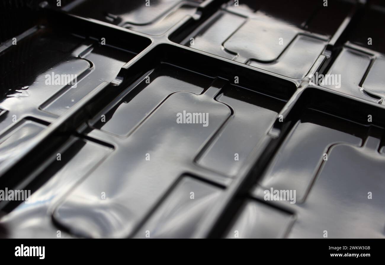 Glossy plastic surface with rectangular compartments Stock Photo
