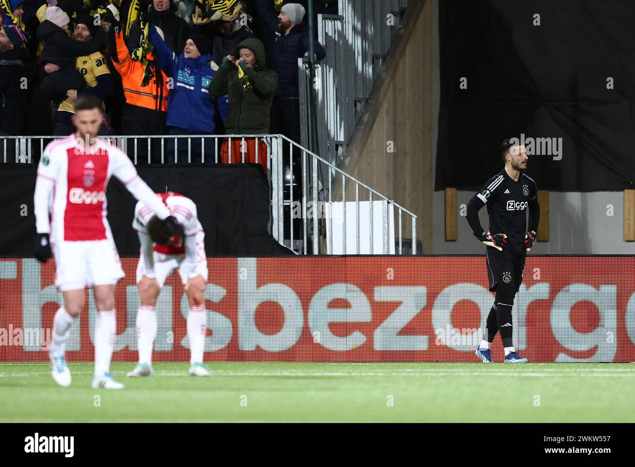 BODØ - (l-r) Branco van den Boomen of Ajax, Josip Sutalo of Ajax, Ajax goalkeeper Diant Ramaj disappointment after the 1-1 during the UEFA Conference League play-off match between FK Bodø/Glimt and Ajax Amsterdam at the Aspmyra Stadium on 22 February 2024 in Bodø, Norway. ANP VINCENT JANNINK Stock Photo