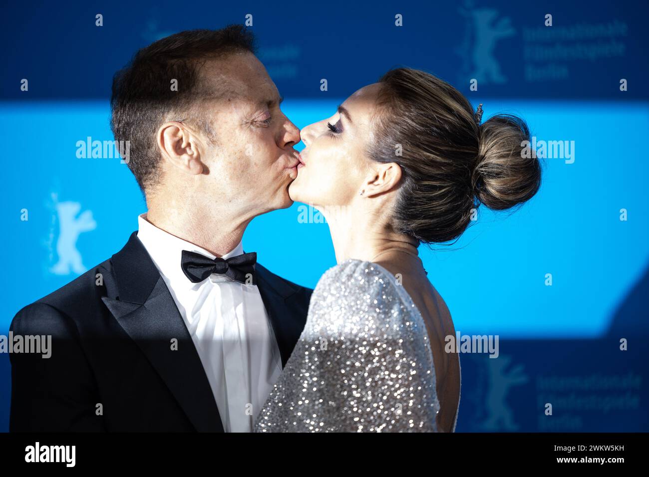 Berlin, Germany. 22nd Feb, 2024. Rocco Siffredi and Rozsa Tassi, his wife,  kiss during the photocall for the film 