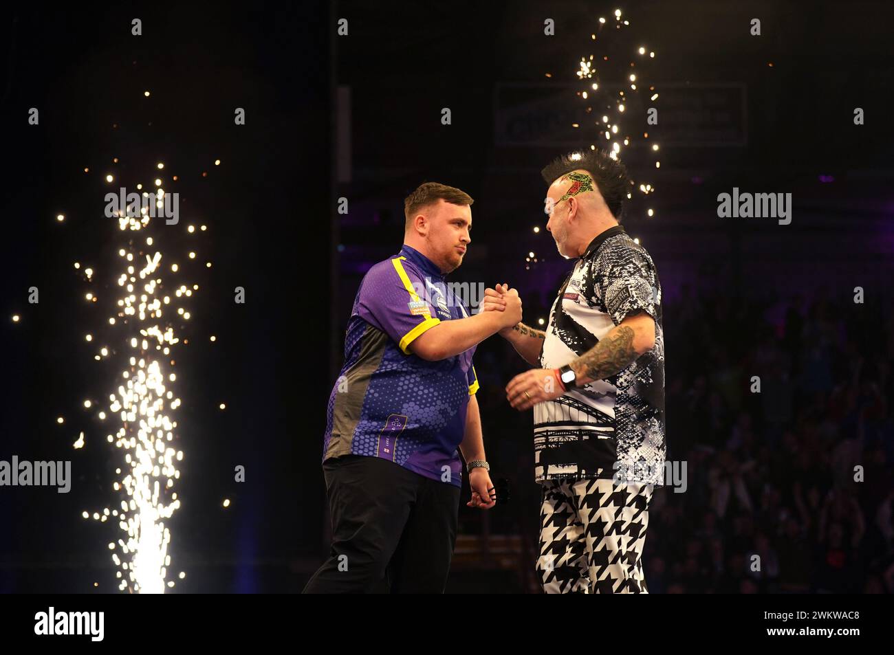 Luke Littler shakes hands with Peter Wright after victory during night four of the 2024 BetMGM Premier League at the Utilita Arena Newcastle. Picture date: Thursday February 22, 2024. Stock Photo