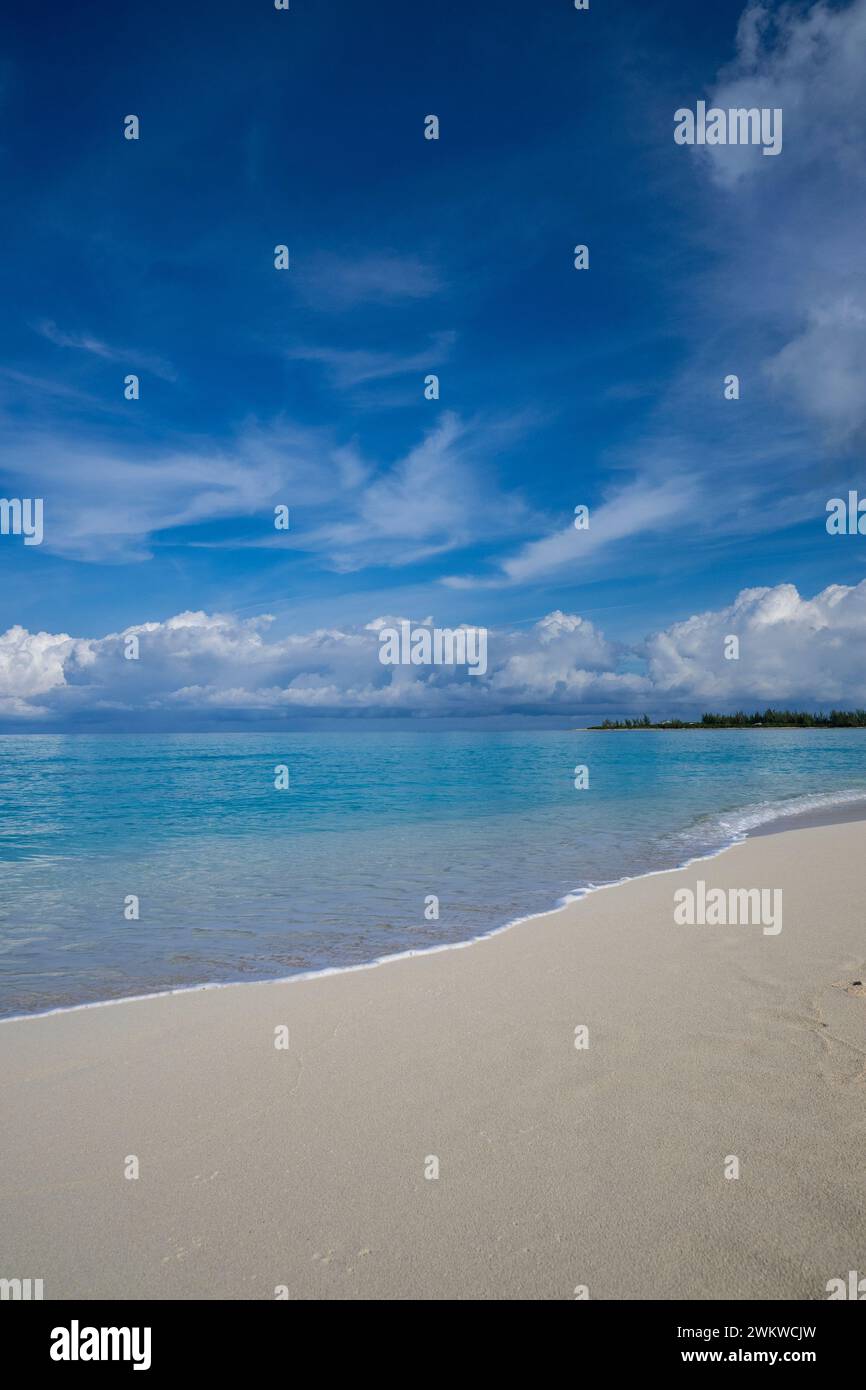 San Salvador Island Bahamas, white sand beach with water gently lapping, almost cloudless sky, warm and inviting, clear water, peaceful, ideal, joy Stock Photo