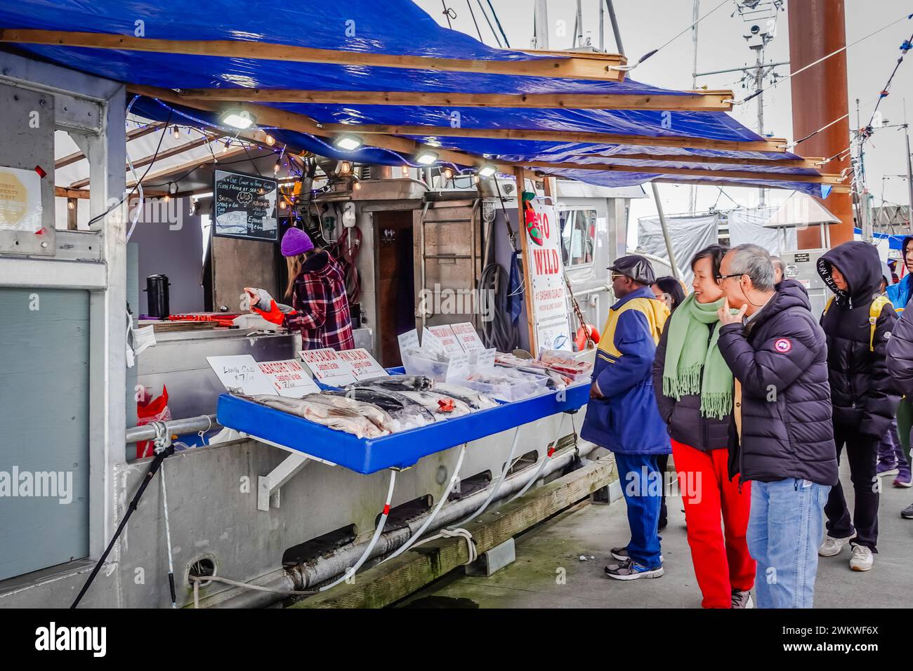 Seafood vendors on fish boats at Steveston Fish Market in Vancouver Stock Photo