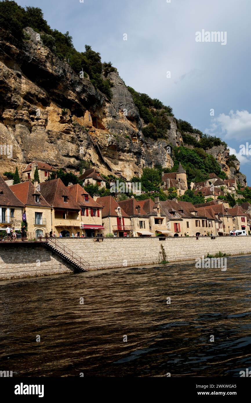 The picturesque French village of La Roque-Gageac on the banks of the Dordogne River is a favoutite destination for tourists and water sport lovers Stock Photo