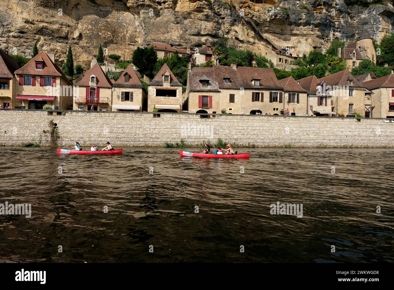 Two paddles boats in the picturesque French village of La Roque-Gageac on the banks of the Dordogne River which is a favourite destination for tourist Stock Photo
