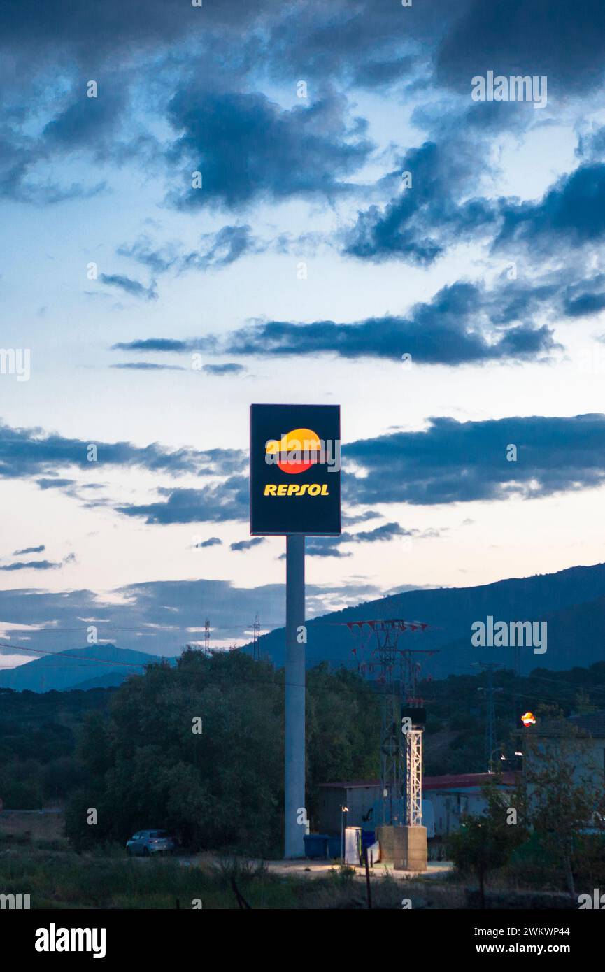 Caceres, Spain - Oct 14th 2023. Repsol highway Petrol Station sign pole. Passage of mountains with cloudy dawn sky Stock Photo