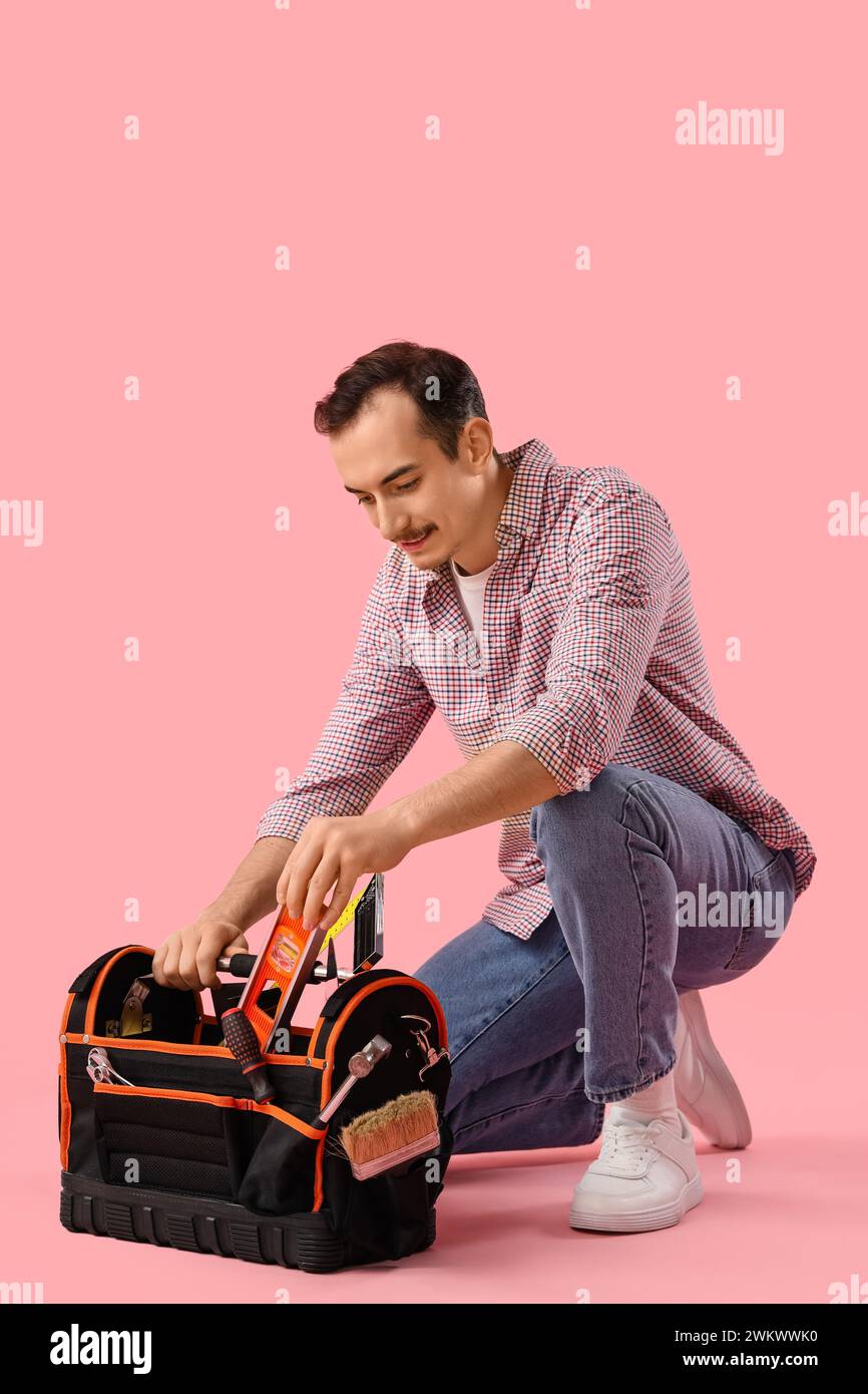 Young man bag tools hi-res stock photography and images - Alamy