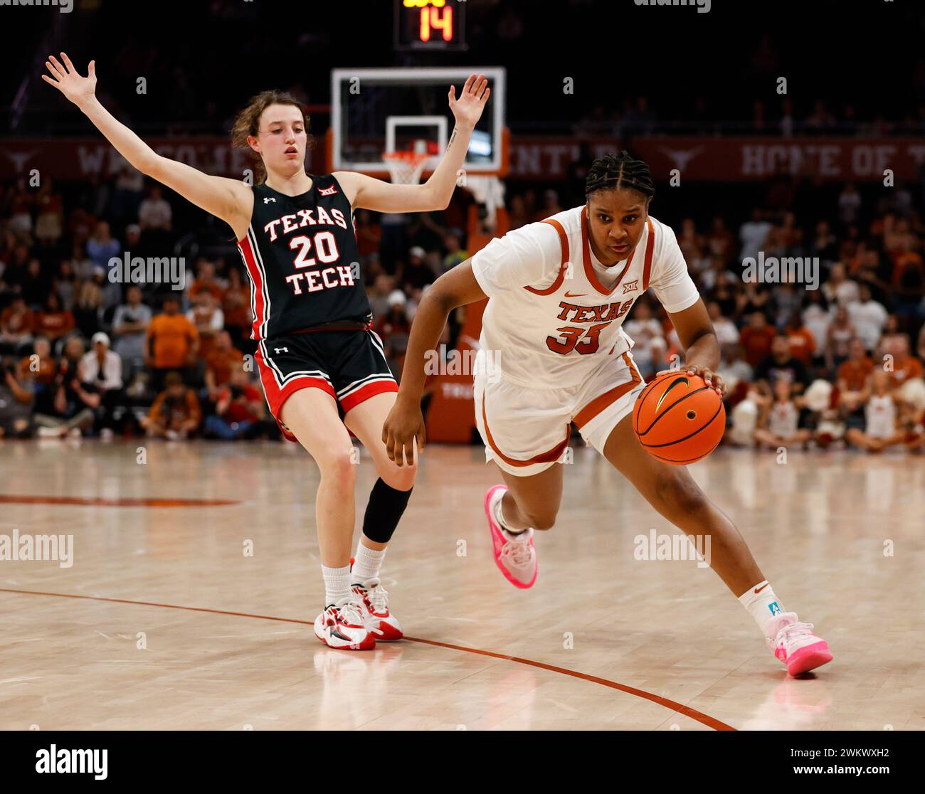 February 21, 2024: Texas forward Madison Booker (35) moves the ball past Texas Tech guard Bailey Maupin (20) as Maurine is called for a foul during a Big 12 women's basketball game between the Texas Longhorns and the Texas Tech Red Raiders on February 21, 2024. Texas won, 77-72. (Credit Image: © Scott Coleman/ZUMA Press Wire) EDITORIAL USAGE ONLY! Not for Commercial USAGE! Stock Photo