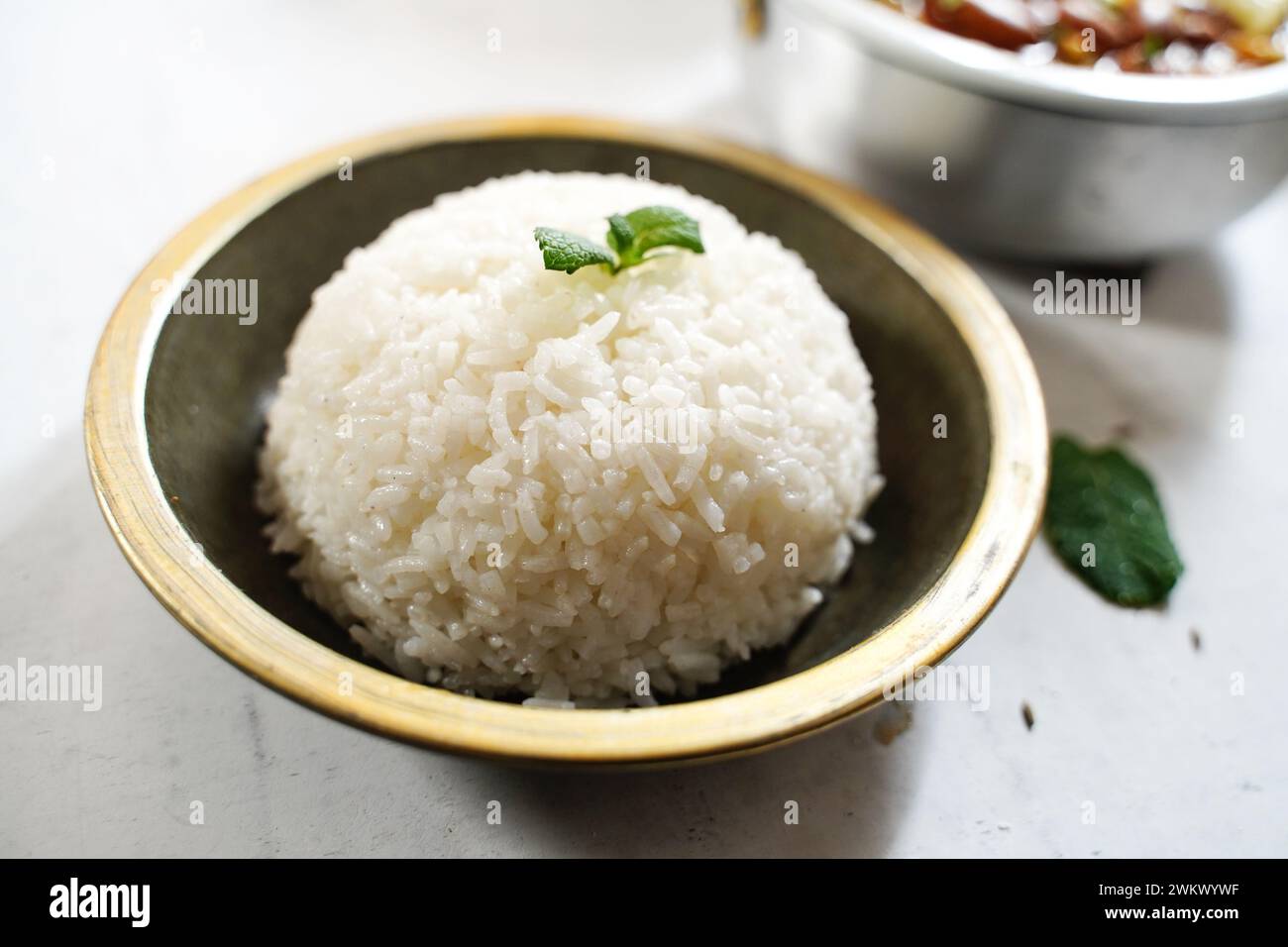 Cooked Thai Jasmine rice served with kidney beans curry Stock Photo