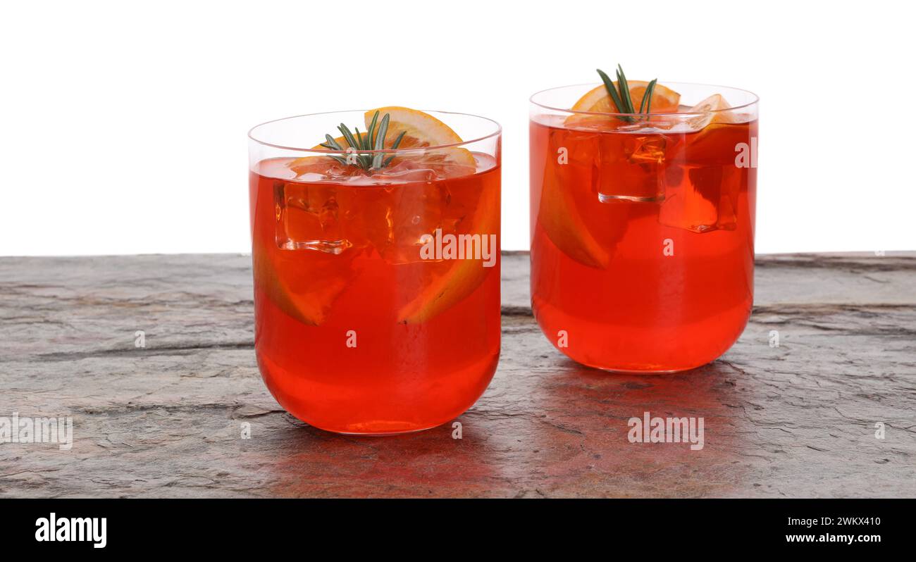 Aperol spritz cocktail, orange slices and rosemary in glasses on grey ...