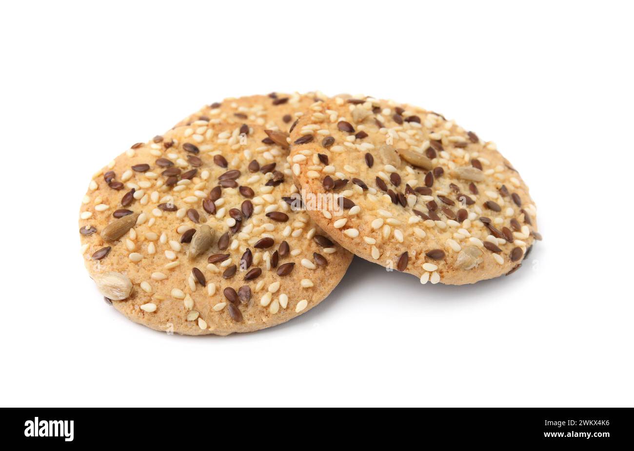 Round cereal crackers with flax, sunflower and sesame seeds isolated on ...