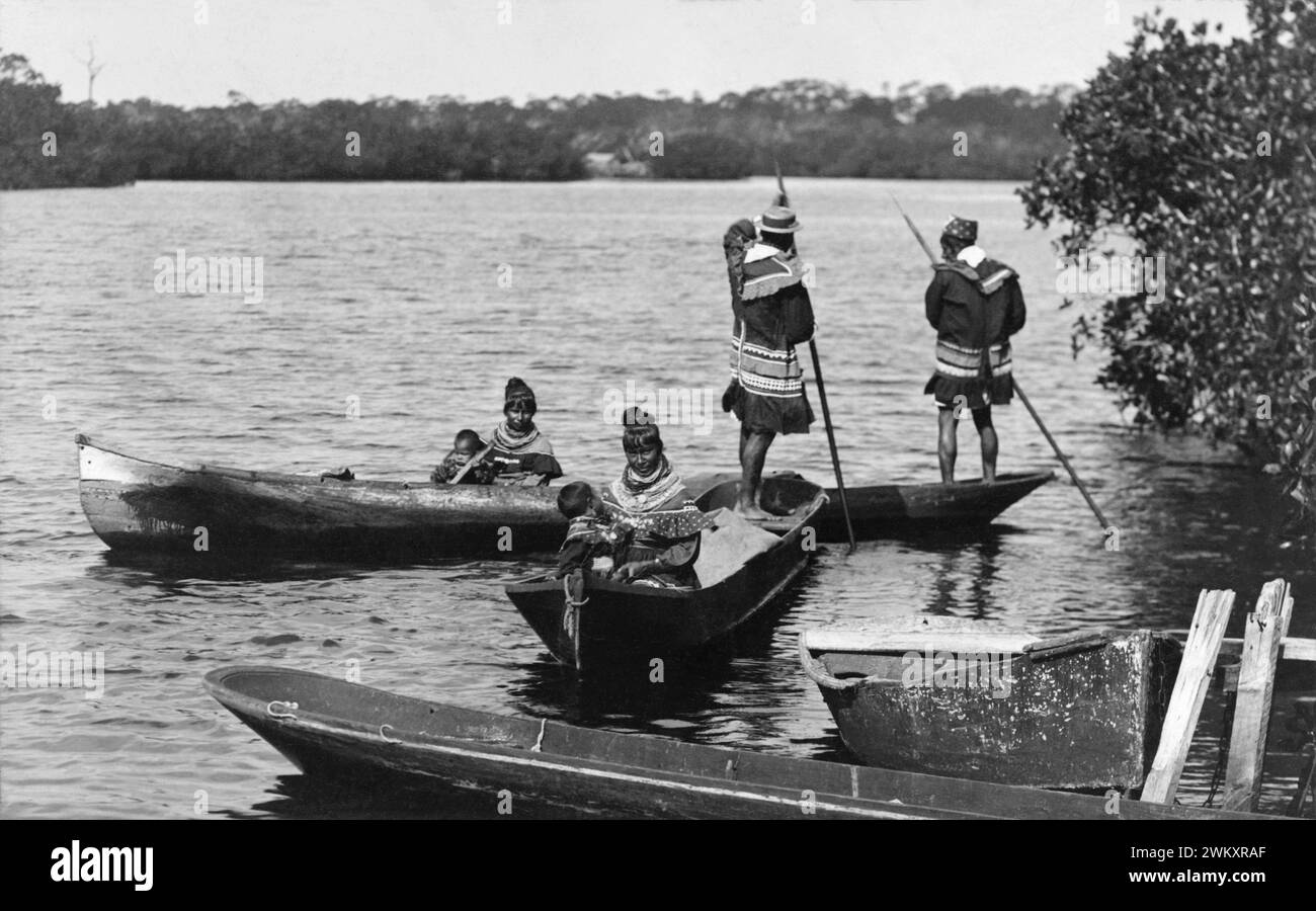 Seminole men, women, and children in canoes on the Miami River in Miami, Florida, c1904. (USA) Stock Photo