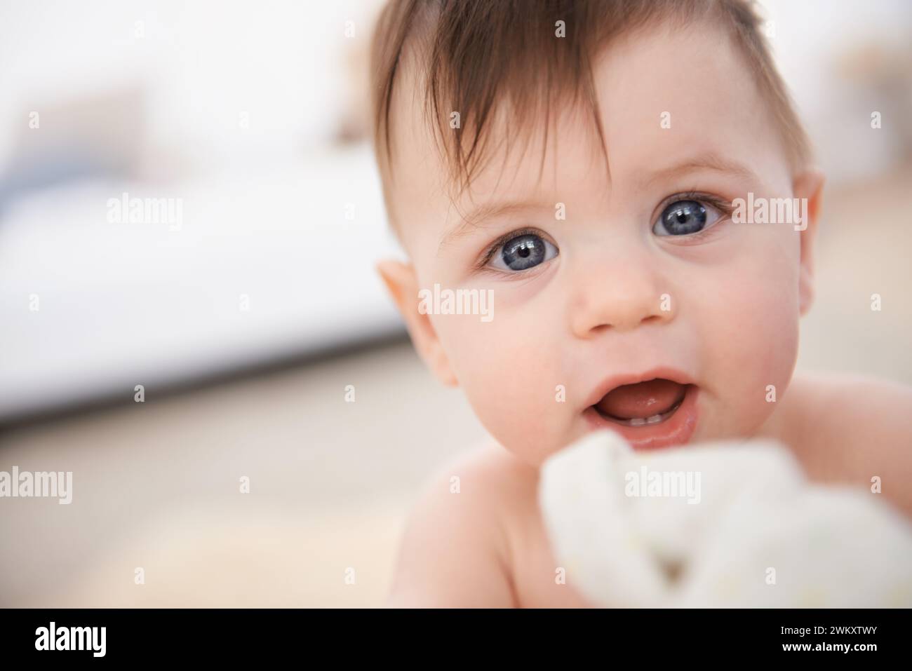 Happy, baby and portrait for growth and development with face of infant with innocence. Toddler, adorable and cute, smiling and teething for childhood Stock Photo