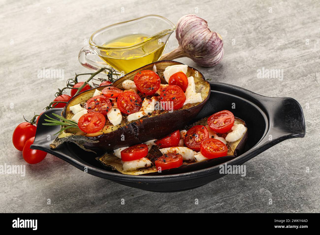 Baked eggplant with mozzarella cheese and tomato Stock Photo - Alamy