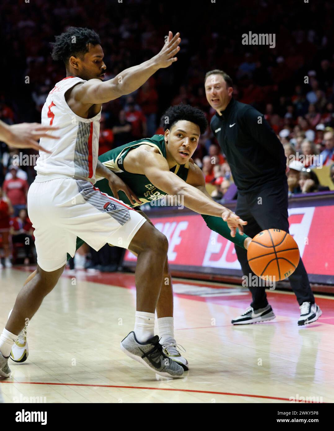 Colorado State guard Josiah Strong passes the ball past New Mexico