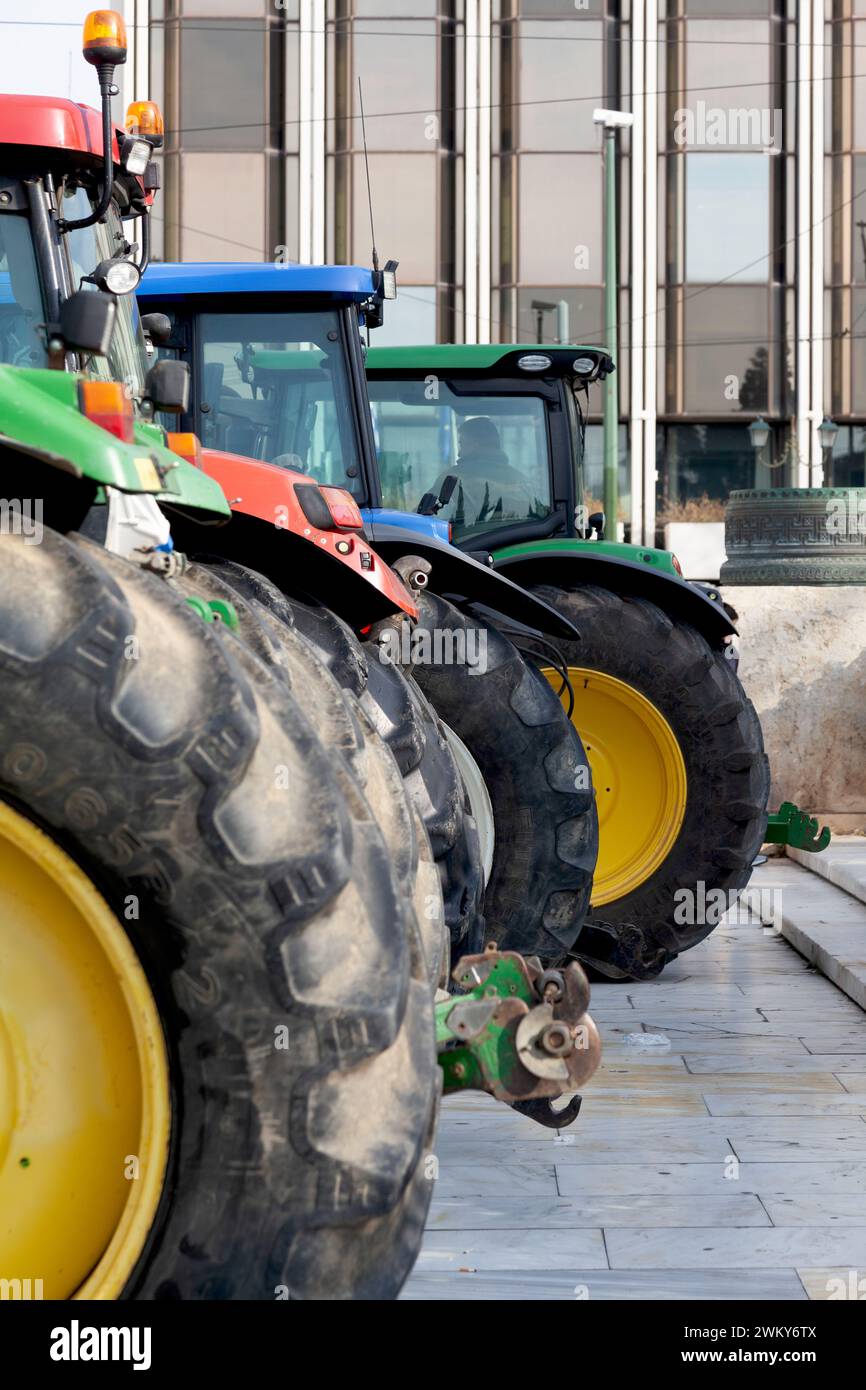 Farm tractors stationed in front of the Greek Parliament during the protest of Greek farmers against the actual crisis in the agricultural sector. Stock Photo
