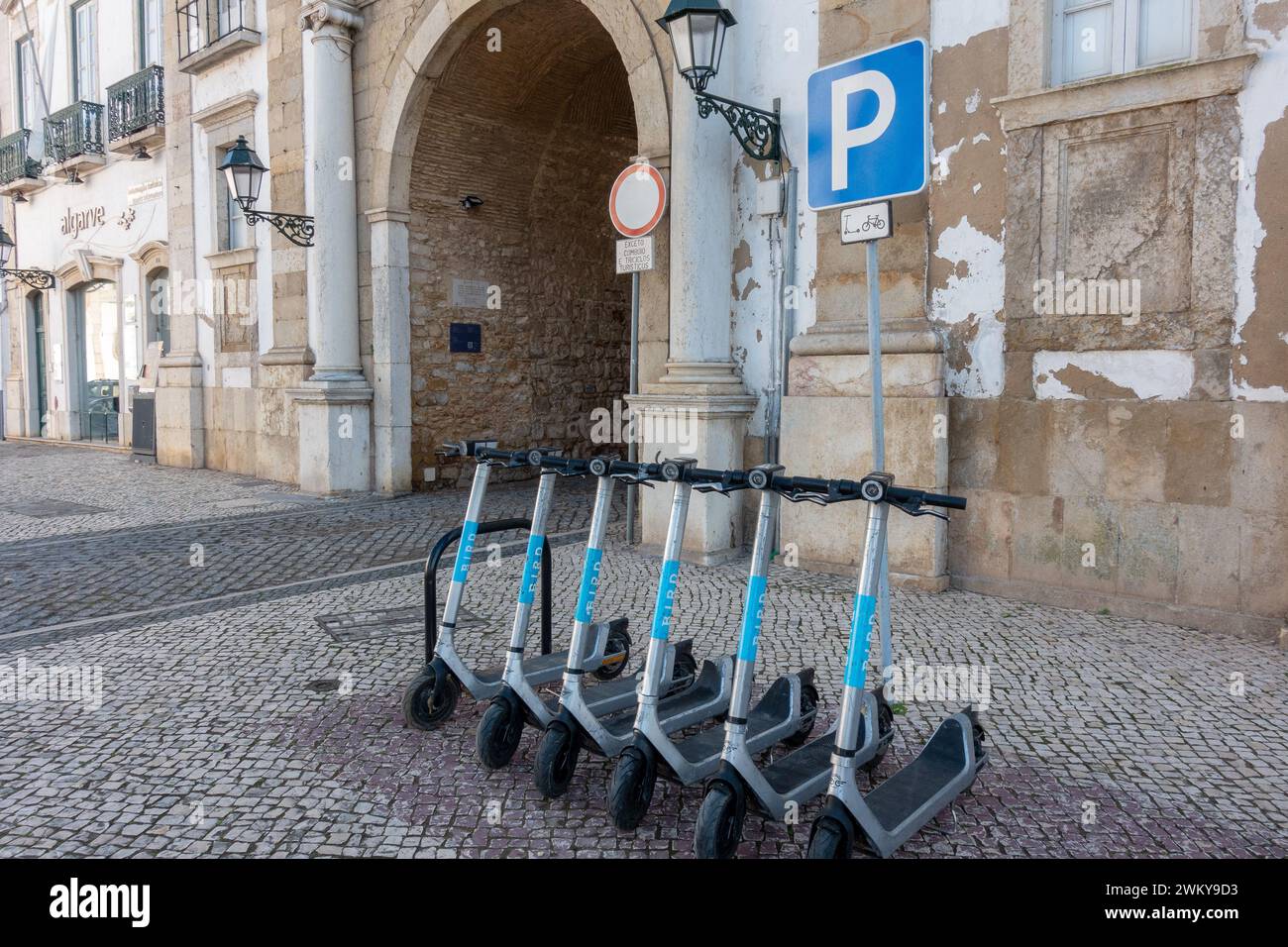 Bird Electric Scooters Lined Up At The Arco da Vila The Town Gate Of  Faro Portugal Ride Share Electric Scooters From Bird February 16, 2024 Stock Photo