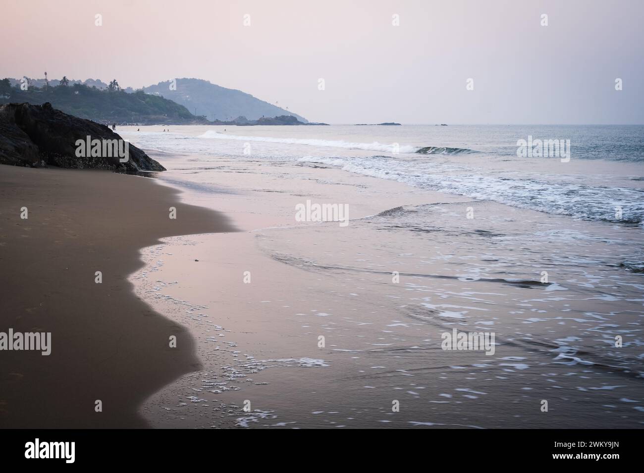Tropical beach in Vagator,India. Early morning view of Vagator beach Goa India. Panoramic view of beautiful tropical Vagator beach, Goa, India Stock Photo