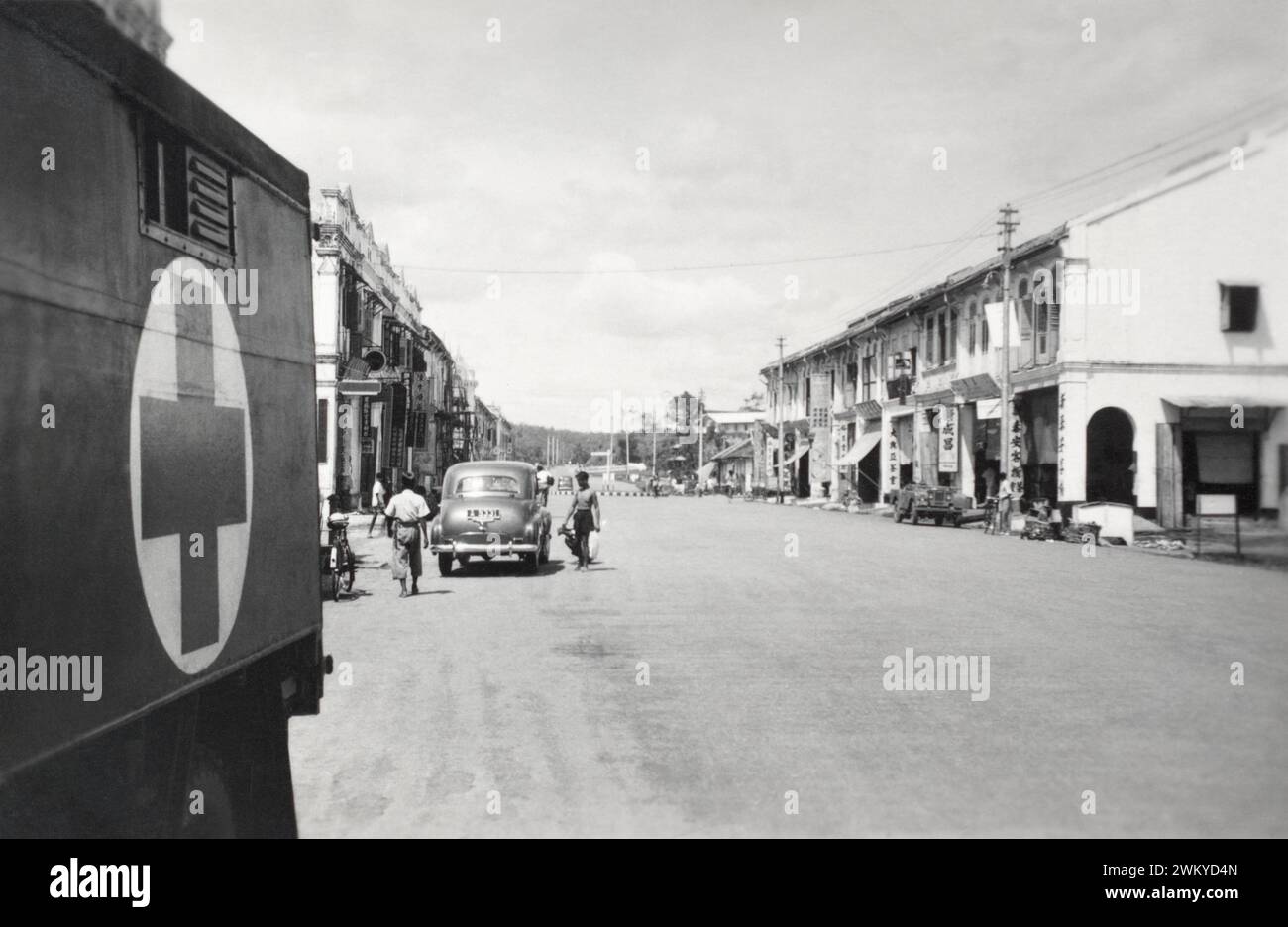 A Royal Army Medical Corps ambulance in a Malayan town during the Malayan Emergancy, 1950. Stock Photo