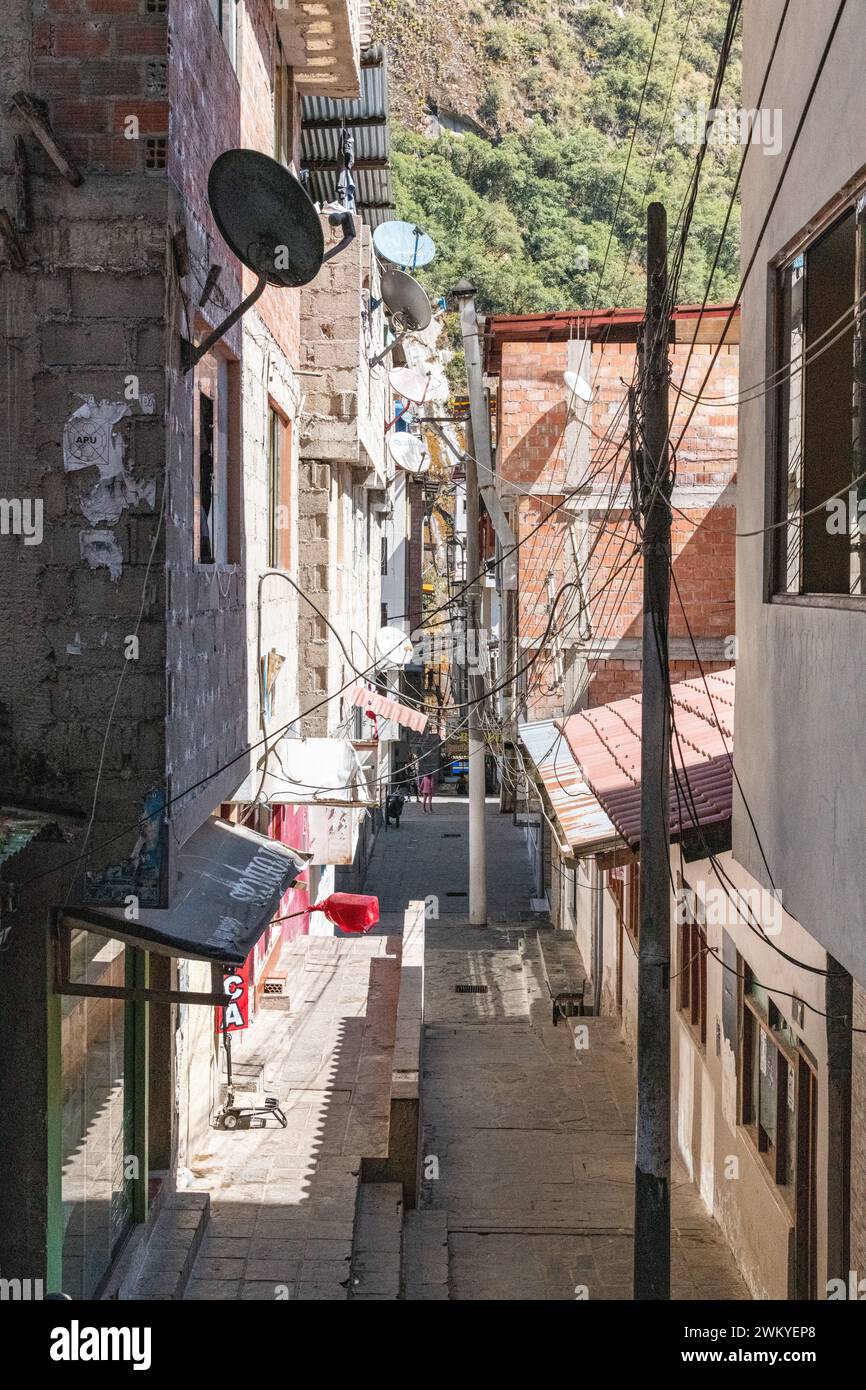 A view of buildings down a street / road / alley in Aguas Calientes, Peru Stock Photo