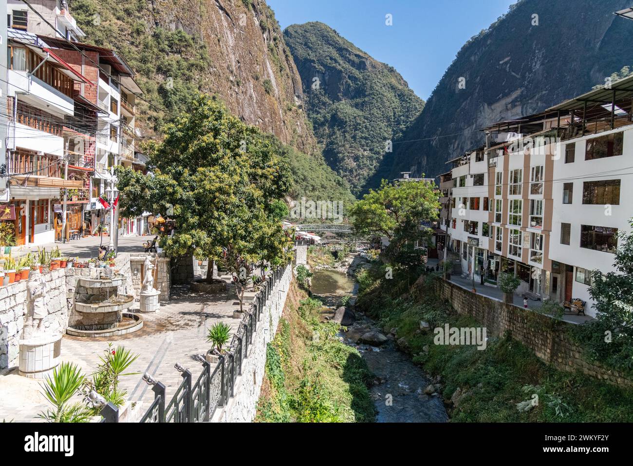 A view of the river flowing through the centre of Aguas Calientes in Peru Stock Photo