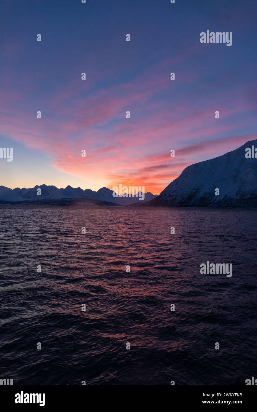 Europe, Norway, Tromso, Troms County, The Lyngen Alps across Ullsfjorden at Dawn Stock Photo