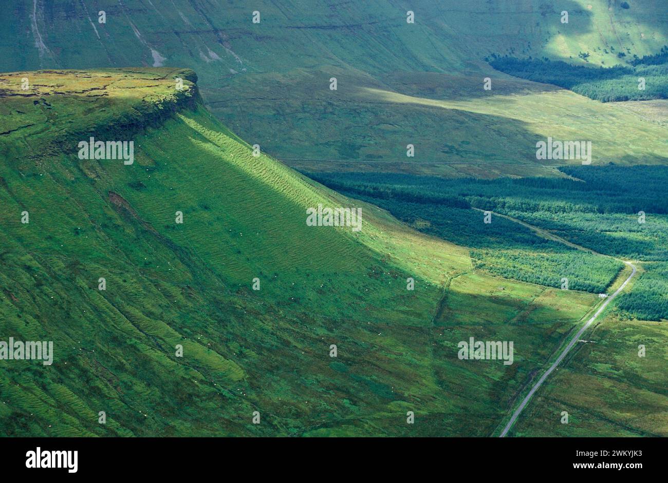A large green hill, resembling a big wave, near Bundoran in the republic of Ireland. Stock Photo