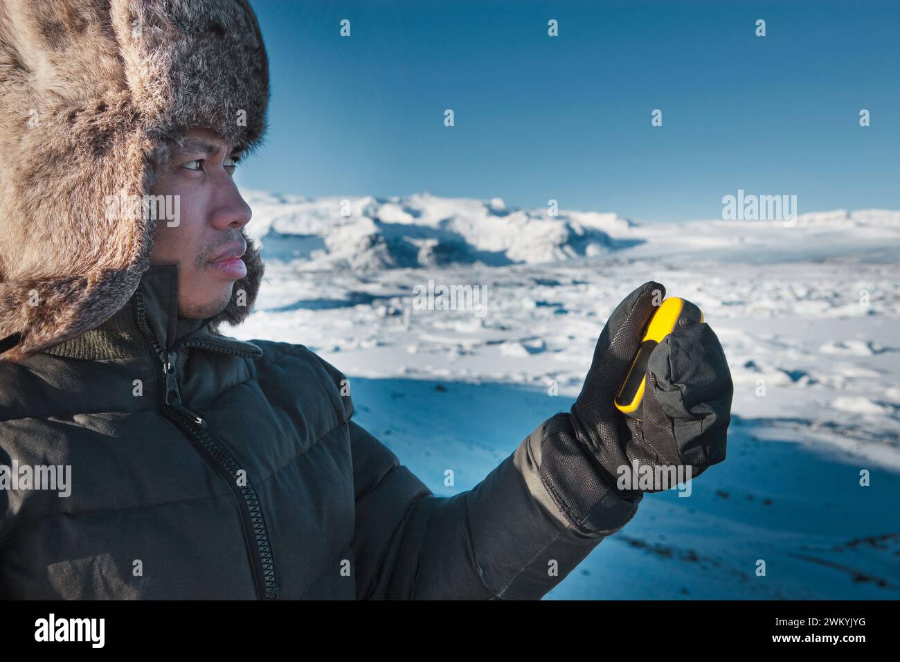 Man navigating in winter lnadscape Stock Photo