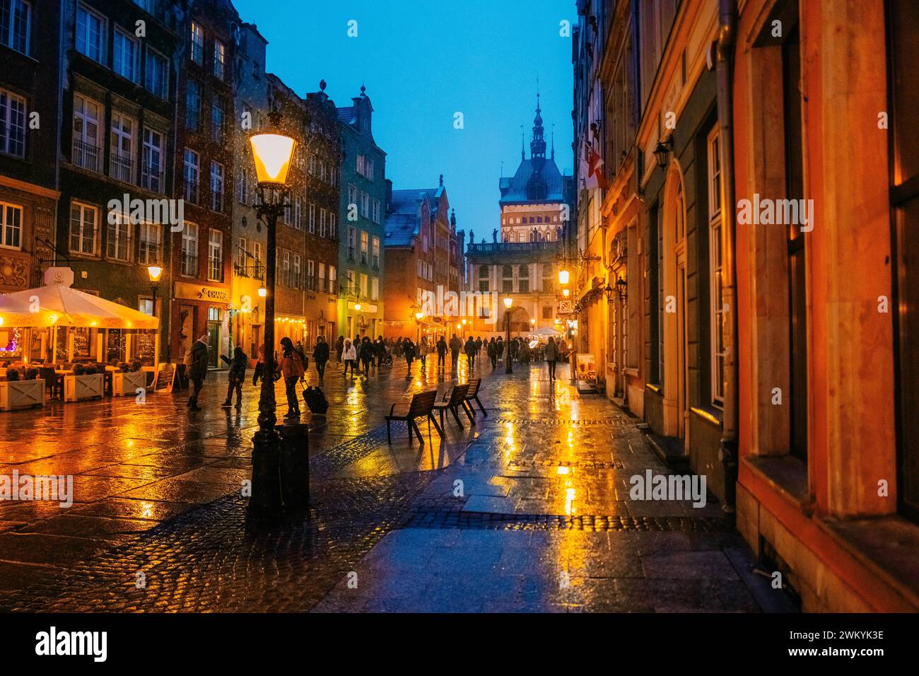 Evening street in the old town in Gdansk Poland, wet snow Stock Photo ...