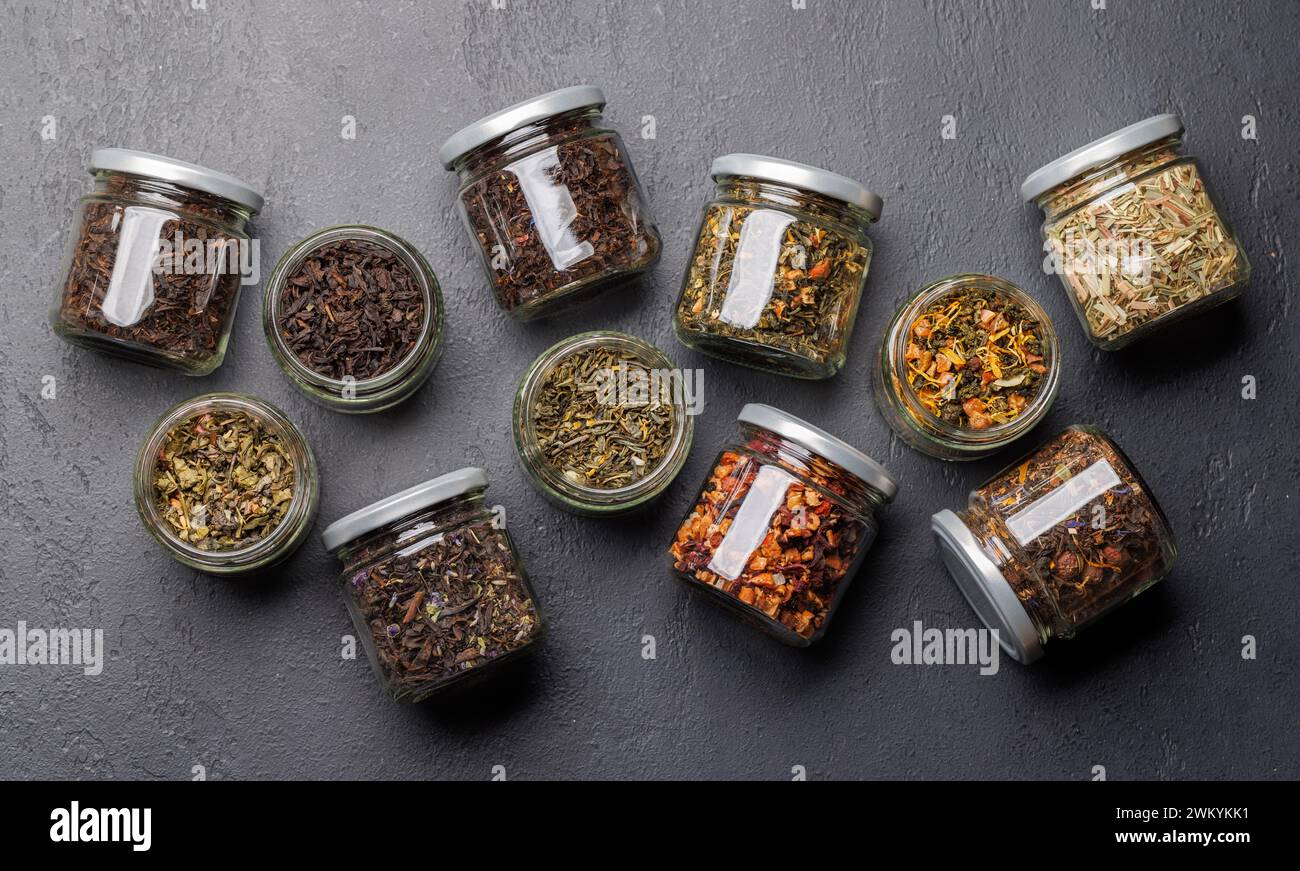 Tea time assortment: Various dry tea leaves. Flat lay Stock Photo