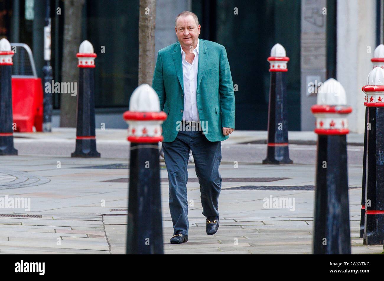 London, UK 23 Feb 2024 Mike Ashley arrives at the High Court. Mike Ashley's company, Fraser Group, is taking Morgan Stanley to court. Mike Ashley's Frasers Group has accused Morgan Stanley of “snobbery” over its decision to impose a $1bn margin call, claiming the bank's move was driven partly by the entrepreneur's humble beginnings. Mike Ashley said Morgan Stanley sought to force the UK retailer out of a position it held in German brand Hugo Boss and said the demand for collateral was completely unbelievable. The dispute relates to long positions Frasers started to accumulate in Hugo Boss fr Stock Photo