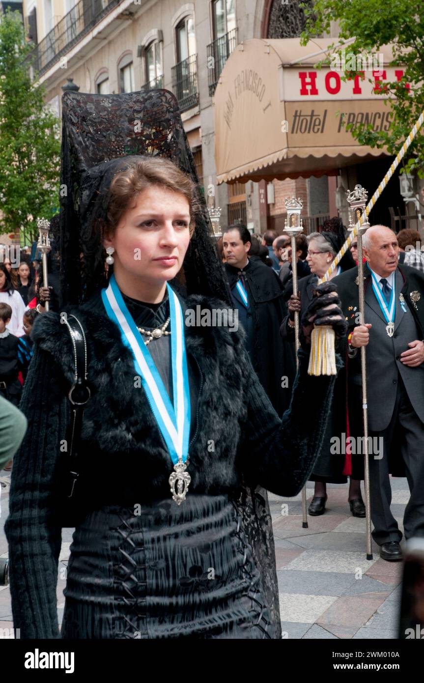 Woman wearing Spanish mantilla in a Holy Week procession. Arenal street, Madrid, Spain. Stock Photo