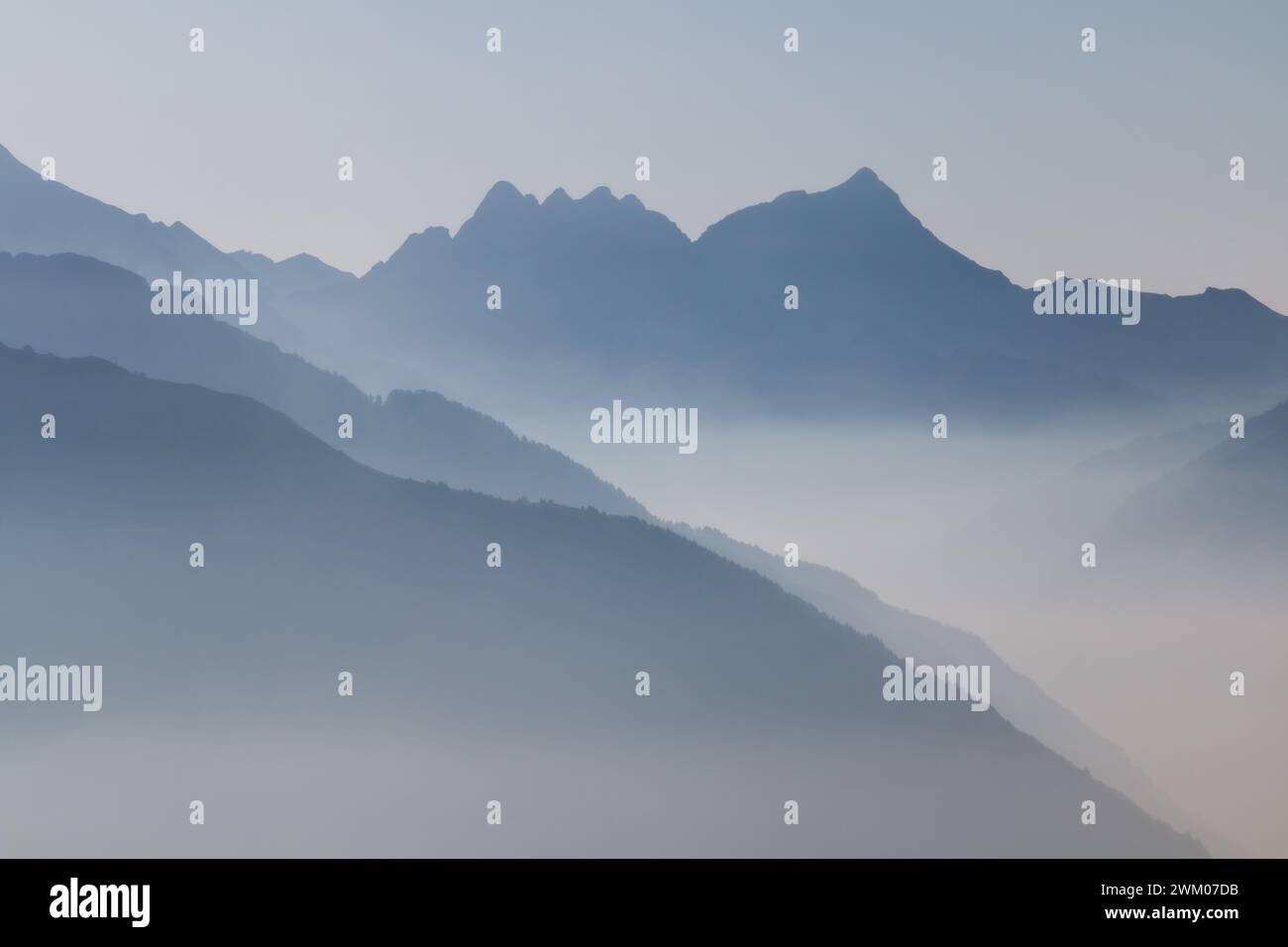 Spectacular mountain ranges silhouettes in shade of grey. Stock Photo