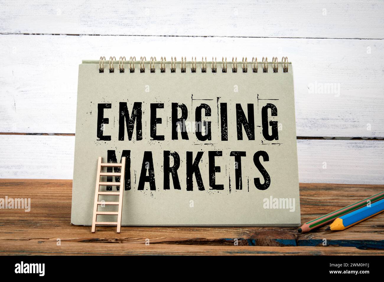 Emerging Markets. Green notepad on wooden texture table and white ...