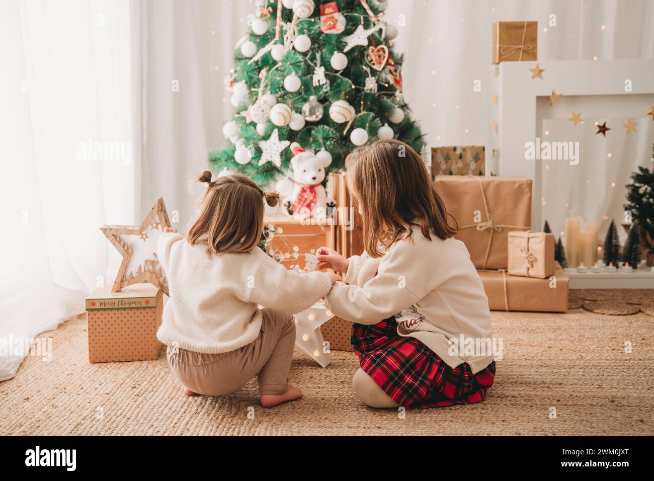 Christmas girls tree hi-res stock photography and images - Alamy