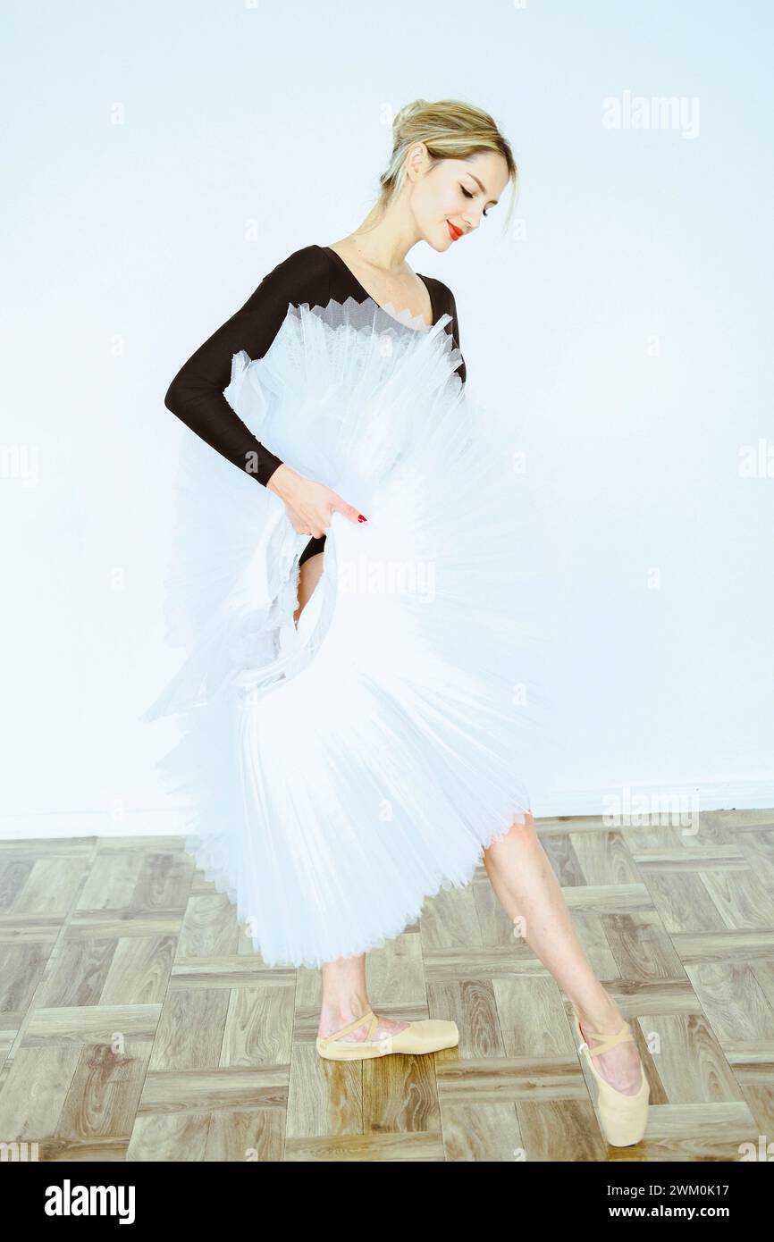 Ballerina practicing ballet dance with tutu in studio Stock Photo