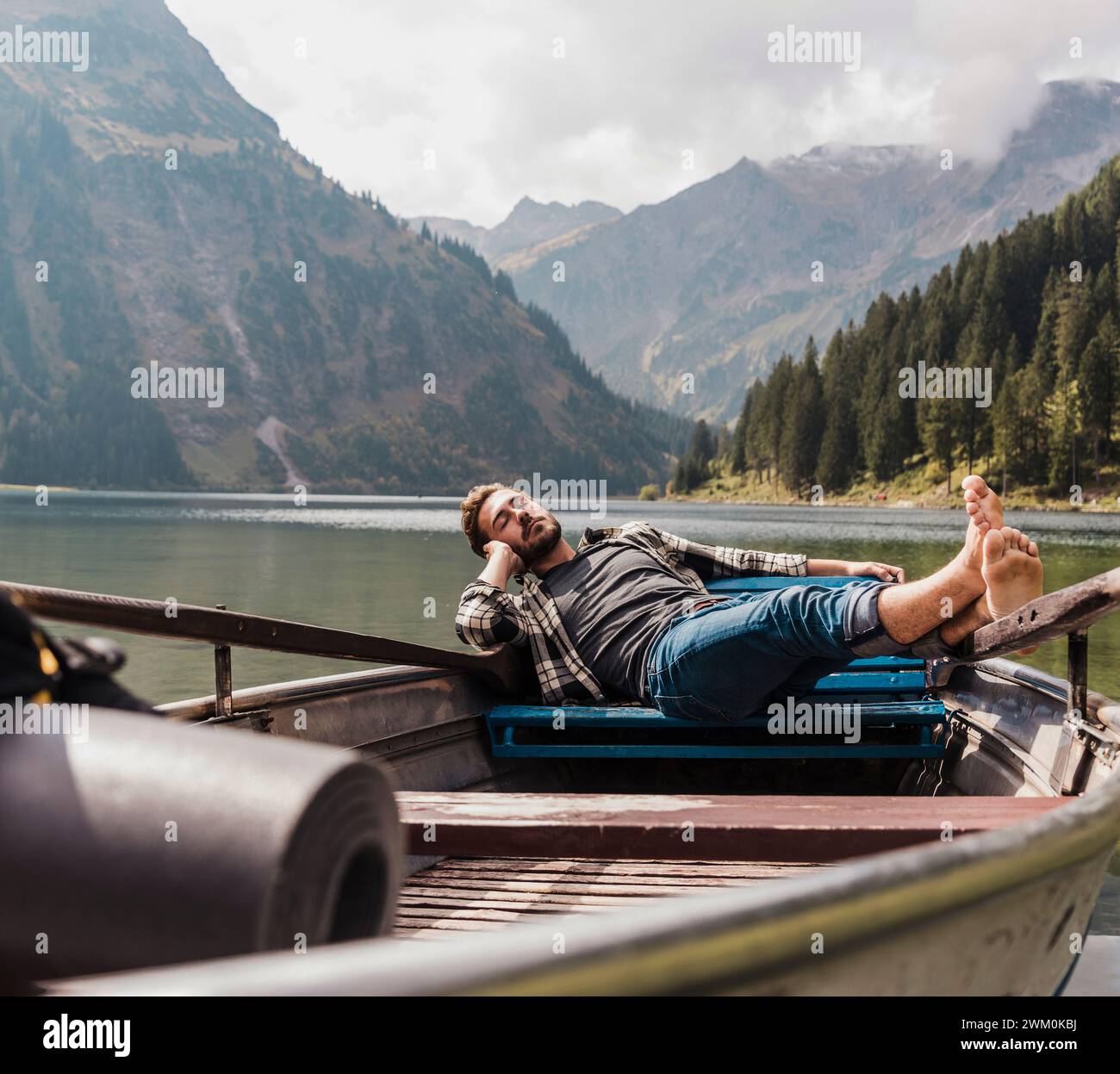 One man fishing and the other sleeping on the boat at Ganges River Stock  Photo - Alamy