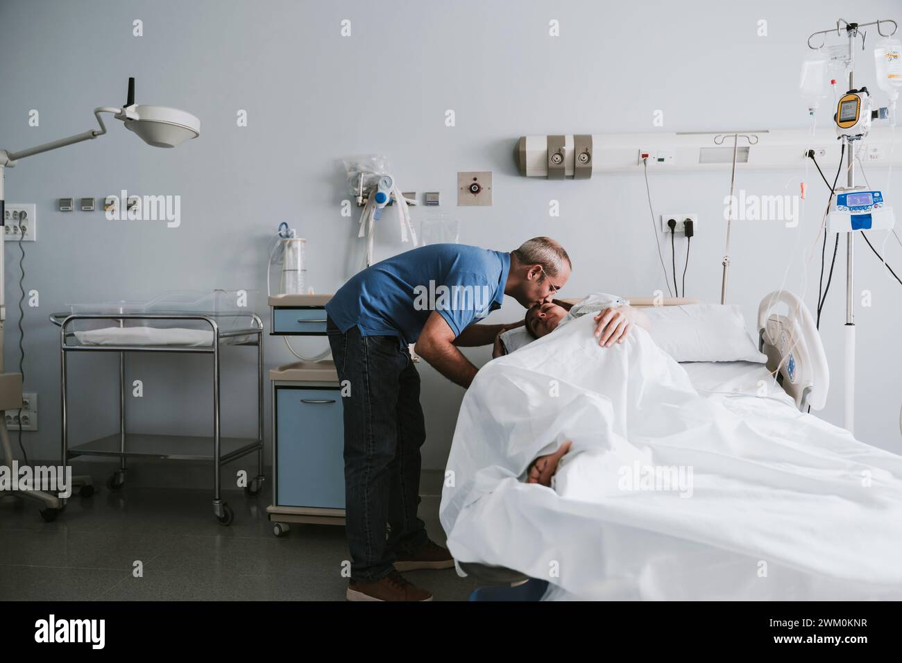 Man lying in hospital bed hi-res stock photography and images - Alamy