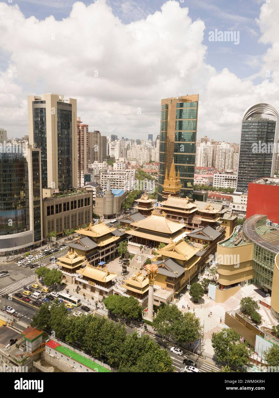 Jing'an temple with various buildings in Shanghai city on sunny day Stock Photo
