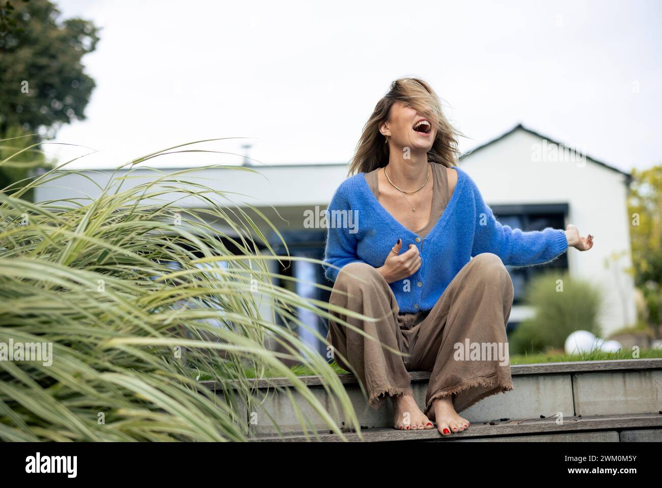 Cheerful caucasian woman sitting in hi-res stock photography and images ...