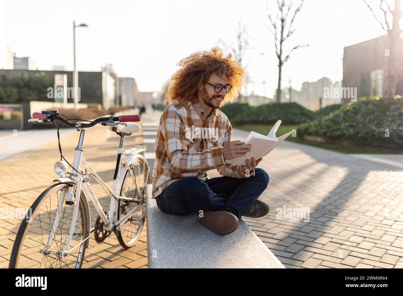 Happy man reading book hi-res stock photography and images - Alamy