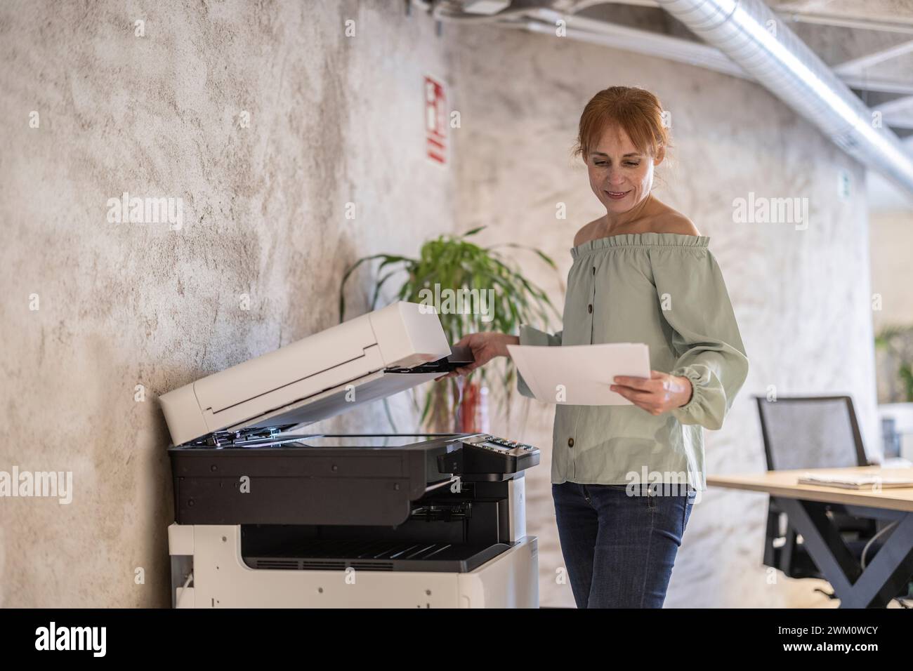 People using photocopier hi-res stock photography and images - Alamy